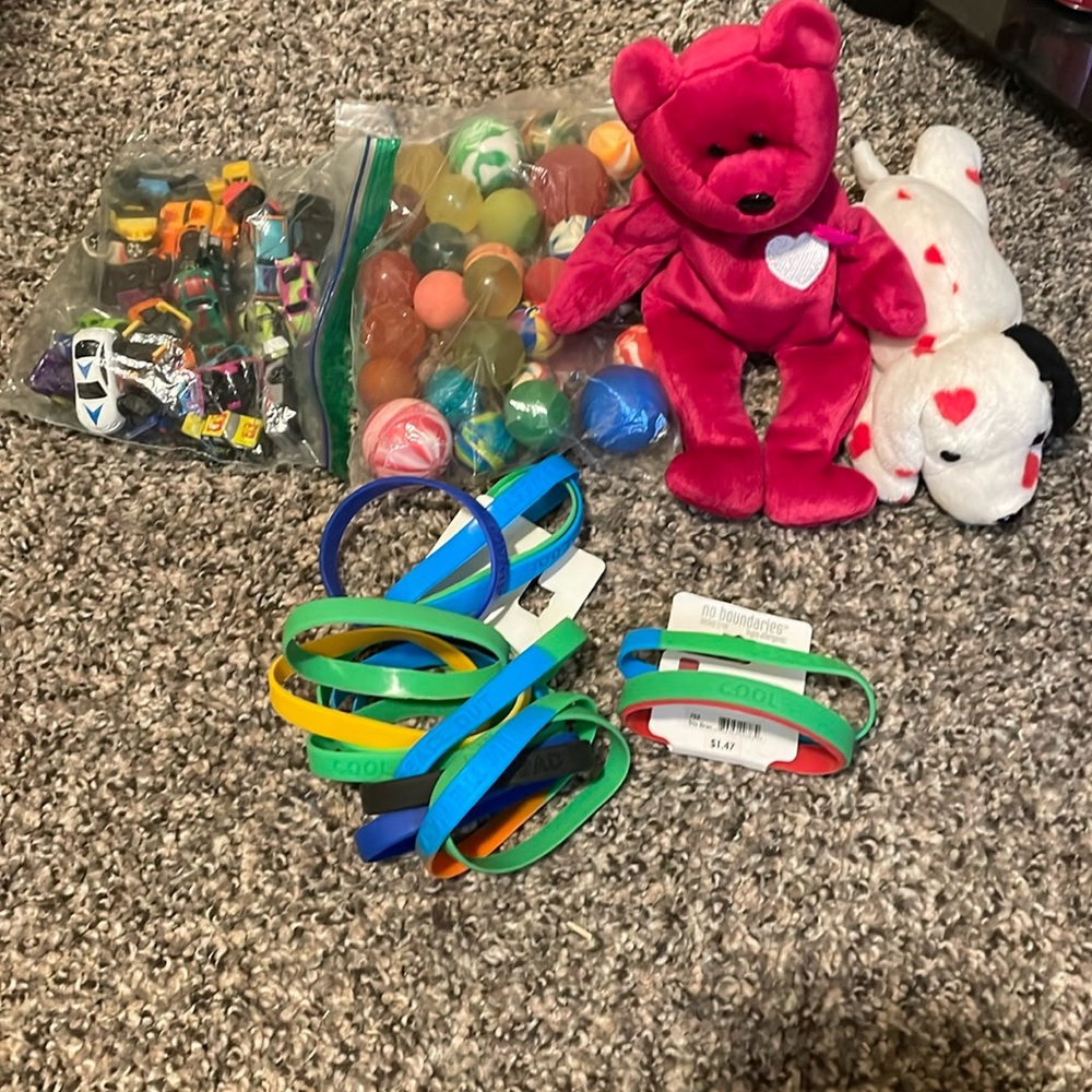 stuffed animals, bouncy balls, toy cars and rubber bracelets